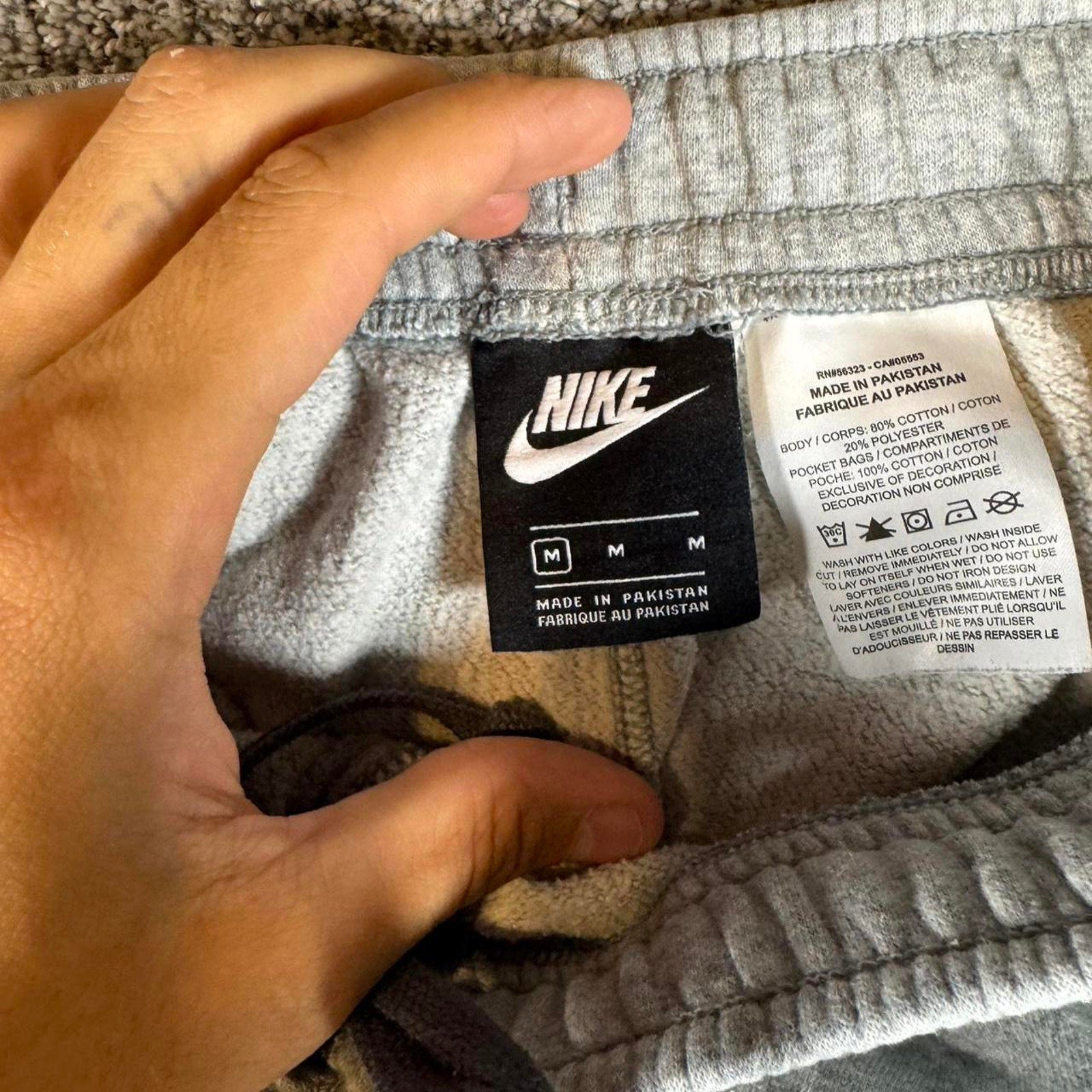 Grey nike joggers with white