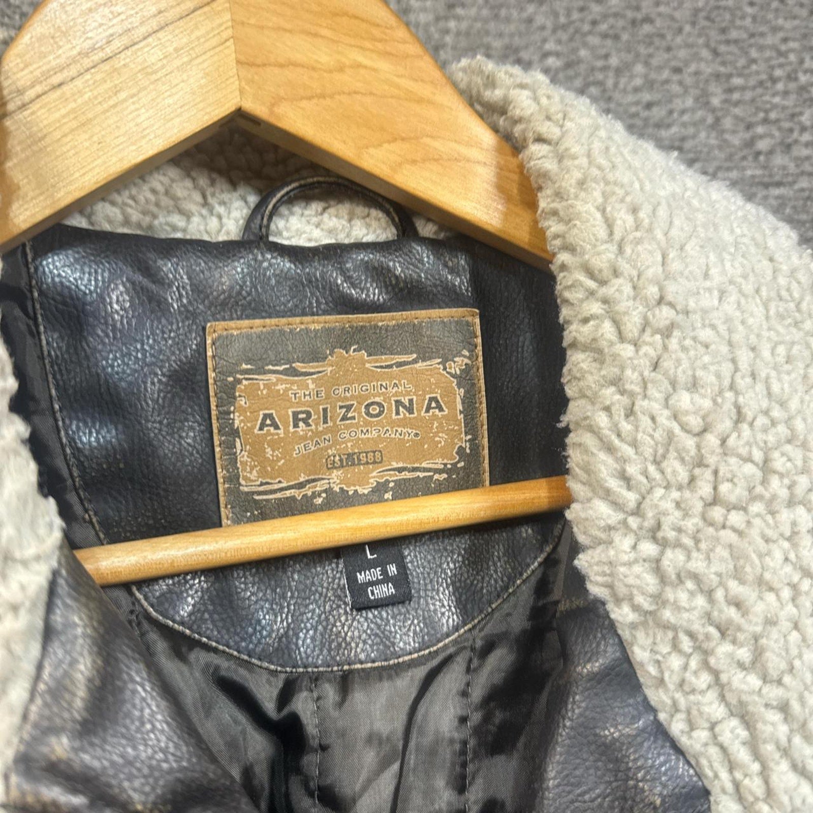 Brown leather jacket with white